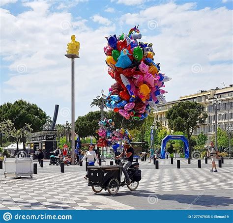 NICE, FRANCE - MAY 2018 : Souvenir Sellers and Tourists Walking in the