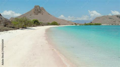 Flight Over Sandy Beach And Turquoise Water Of Pantai Merah Pink Beach