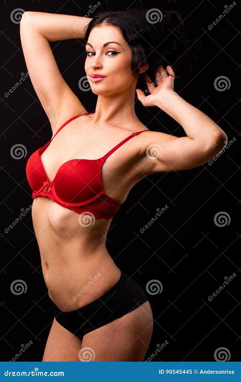 Portrait Of Brunette Woman In Red And Black Underwear On A Stock Image