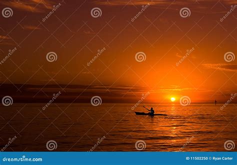 Kayaking at sunset stock photo. Image of sport, people - 11502250