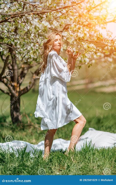 Blond Garden Portrait Of A Blonde In The Park Happy Woman With Long Blond Hair In A Blue Dress