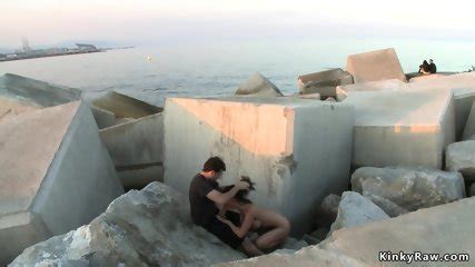 Brunette In Metal Shackles In Public