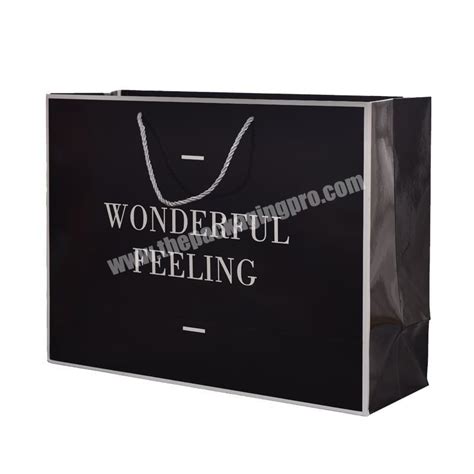 New Gold Logo Hot Foiled Stamping Black Matt Kraft Paper Bag Custom Print Luxury Packaging