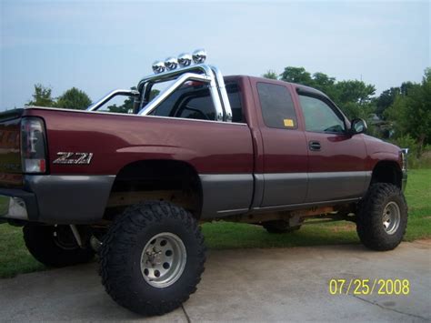 Lifted Chevy With Roll Bar And Kc Lights