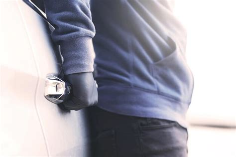 Premium Photo Midsection Of Man Holding Umbrella Standing Against Wall