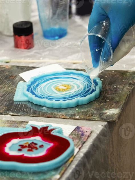 The art process of pouring epoxy resin into a wooden toy. Technology