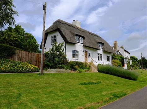 Traditional English, Thatched Roof Cottages Seen in a Very Well Maintained Condition. Editorial ...