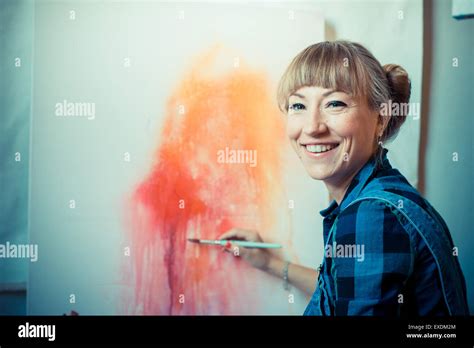 Beautiful Blonde Woman Painter In Her Studio Stock Photo Alamy