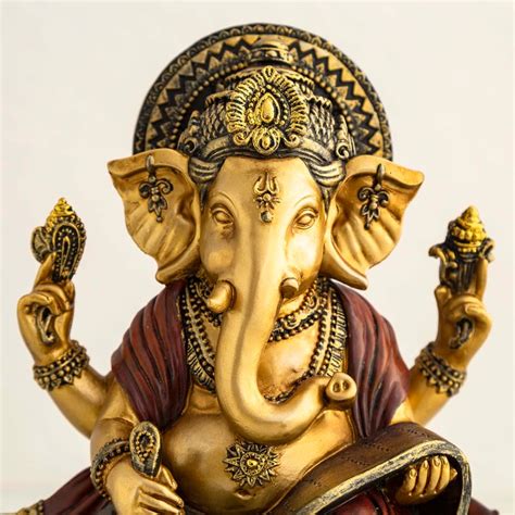 Buy Dhyana Gold Polyresin Sitting Ganesha Posture Figurine From Home