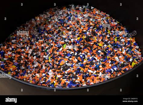 Plastic Pellets Made Of Multicolored Recylced Bottle Caps In A Black