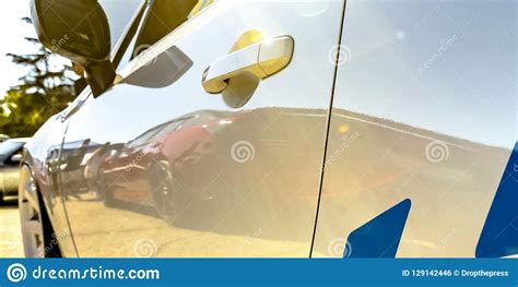 Reflective White Car with Decals on a Sunny Day Stock Photo - Image of ...