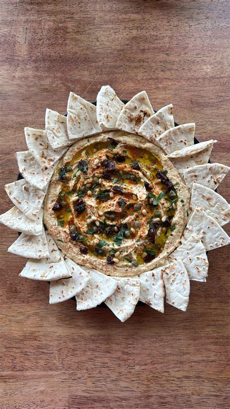 Homemade Hummus Garnished With Kalamata Olives Capers Pine Nuts