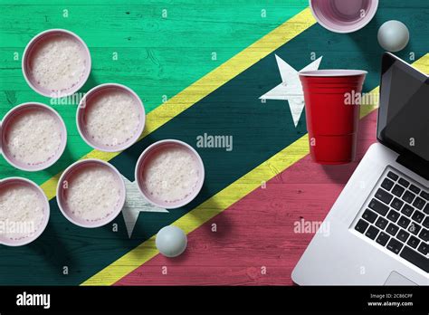 Saint Kitts And Nevis flag concept with plastic beer pong cups and
