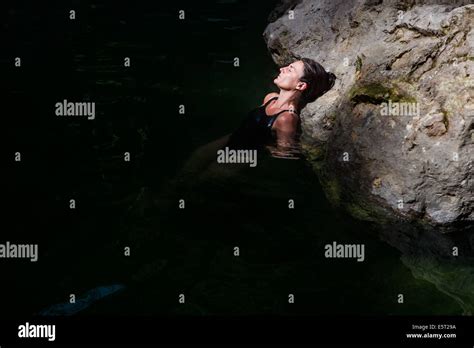 Woman Bathing In Geothermal Hot Springs Stock Photo Alamy
