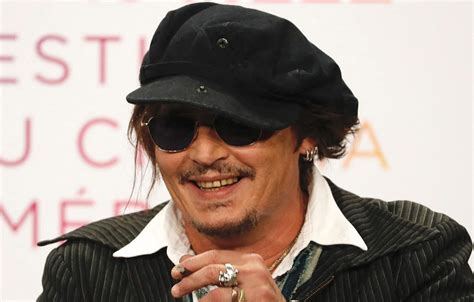 Johnny Depp Shows Off New Teeth In New Video