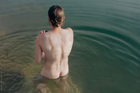 Guy Bathes Naked In The Water Of The River Photo From The Back Del