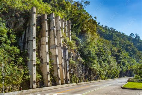 Landslide protection with reinforced concrete walls or spray concrete ...