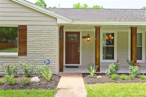 White Painted Brick House With Cedar Shutters Warehouse Of Ideas