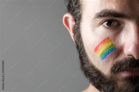 Man With Rainbow Painted On His Cheek Symbol Of Gay Rights Stock Photo Adobe Stock