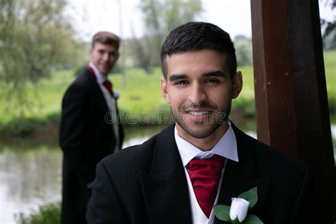 Gay Couple Of Grooms Pose For Photographs By A Lake On Their Wedding Day Stock Image Image Of