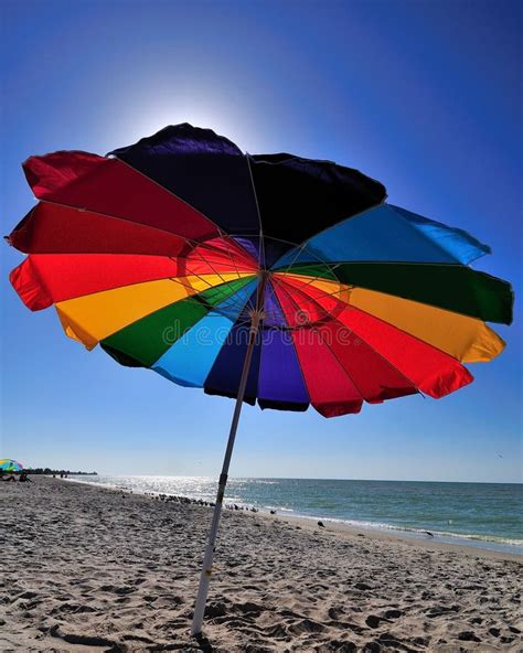 Bright Colored Beach Umbrella On A Sunny Beach Day Stock Photo Image