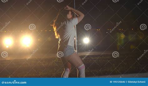 Woman is Twerking Near a Pole, Stripper, Cars in the Background, 4k 