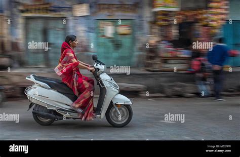 india lady riding scooter  res stock photography  images alamy