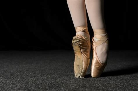 Close Up Of Ballerina Feet With Pointe Shoes Free Photo