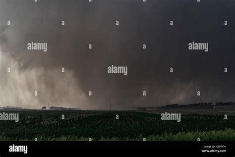 A violent, rain-wrapped wedge tornado rips up farmland in rural Kansas Stock Photo - Alamy