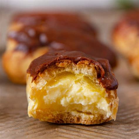 Chocolate Eclairs with creamy vanilla custard filling topped with ...