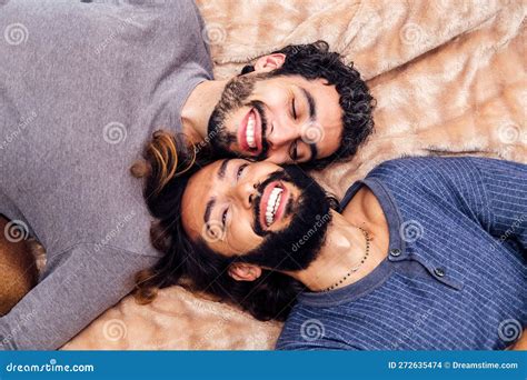 Happy Gay Male Couple Laughing Lying On The Bed Stock Photo Image Of Couple Home 272635474