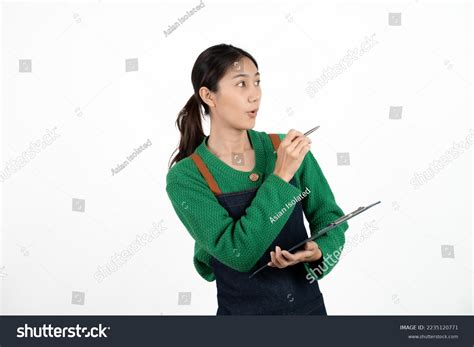 Portrait Smiling Mature Woman Apron Holding Stock Photo 2235120771 Shutterstock