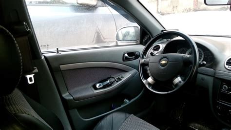 Внутренние ручки открывания дверей. — Chevrolet Lacetti 5D, 1,6 л, 2009 ...