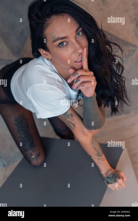 Sexy Brunette Girl Posing Looking Straight At The Camera Stock Photo Alamy