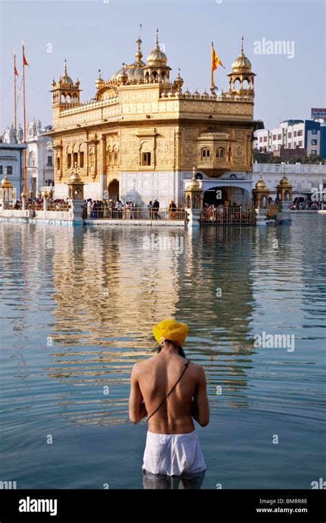 Sikh Man Bathing In The Sacred Pool The Golden Temple Amritsar