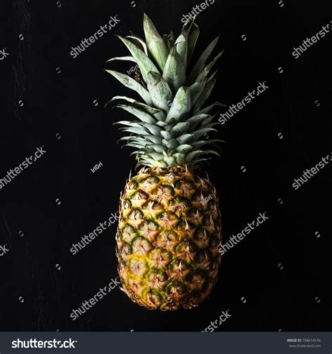 Golden Tropical Leaves Pineapple On Black Background Over Royalty