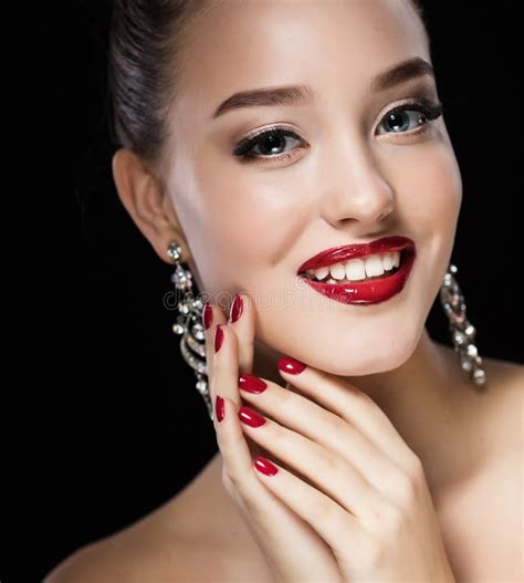 Beautiful Brunette Woman With Bright Make Up And Jewelry Earrings Smiling Close Up Stock Photo