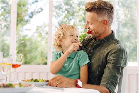 Cute Curly Blonde Haired Son Giving Tomato To His Father Stock Image Image Of Loving Summer