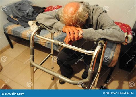 Sad Poor Elderly Man Sitting Alone On His Bed Editorial Photography