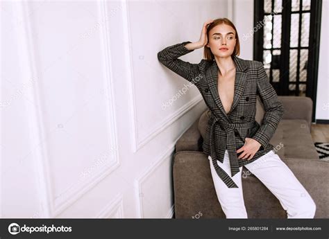 A Beautiful Sweet Girl Dressed On A Naked Body Jacket Golden Stylish Model With Short Hair