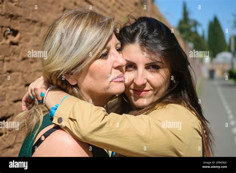 Mother And Daughter Hugging And Expressing Affection Mothers Day