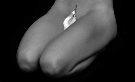 Premium Photo Midsection Of Naked Woman With Leaf On Vagina Kneeling Against Black Background