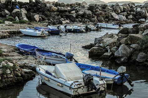 Premium Photo Boats Moored On Sea Shore