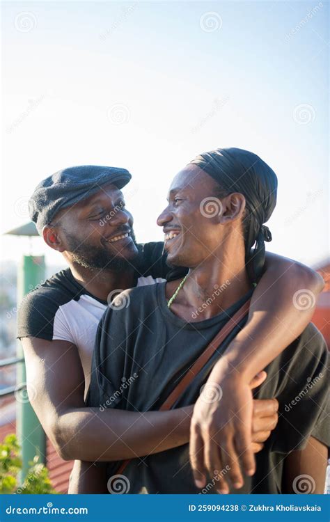 Portrait Of Romantic African Gay Couple Hugging For Photo Stock Photo Image Of Mutual Blue