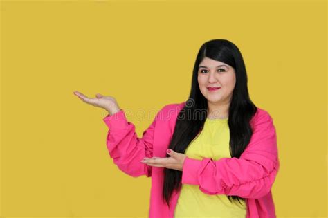 Latina Year Old Woman Points At Copy Space For Promotions And Discounts Stock Photo Image