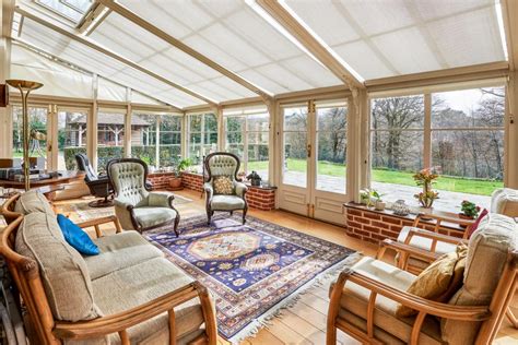 Glass Conservatory With Blue Rug Hgtv