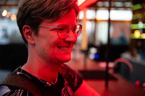 Colorful Indoor Light Portrait Of A Yo Woman With Short Blonde Hair