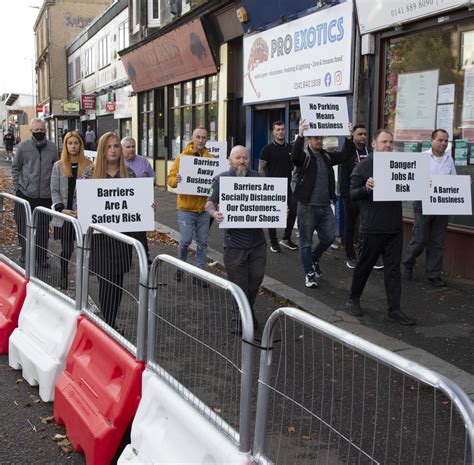 Shopkeepers protest at barriers erected outside their premises