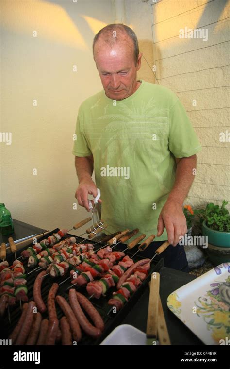 Man Cooking On Bbq Stock Photo Alamy