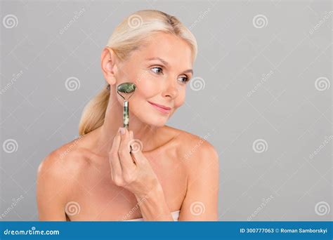 Photo Of Positive Shiny Old Woman Naked Shoulders Doing Lifting Procedures Empty Space Isolated